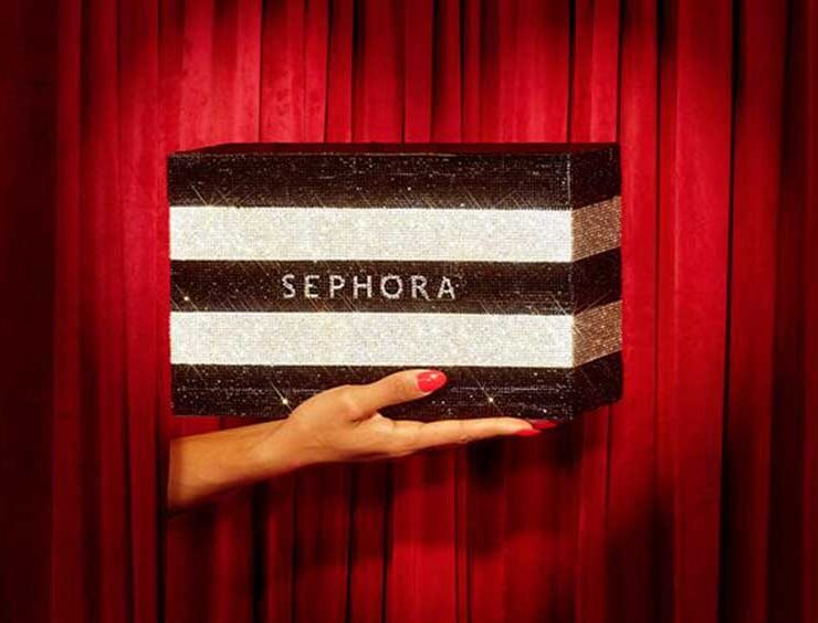 Hand holding Sephora shopping bag