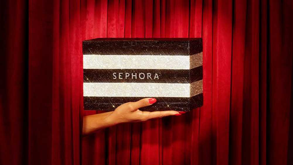 Hand holding Sephora shopping bag